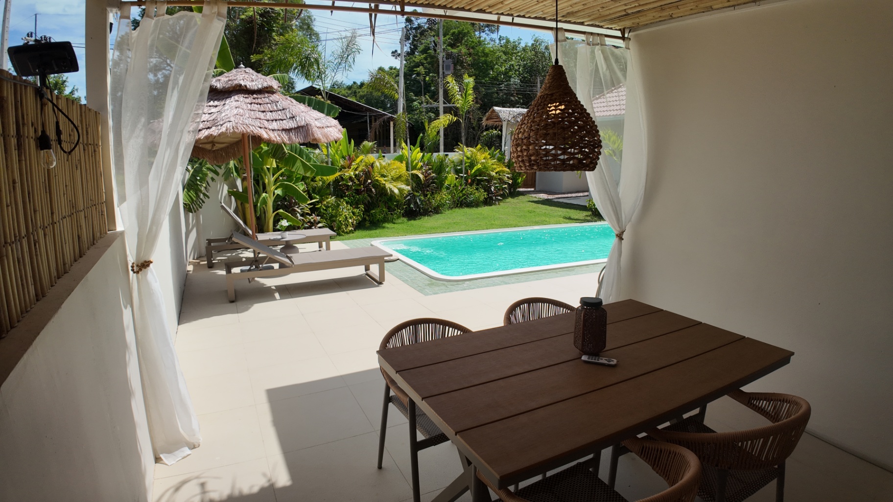 Poolside exterior corner at Villa Reina with tropical planting