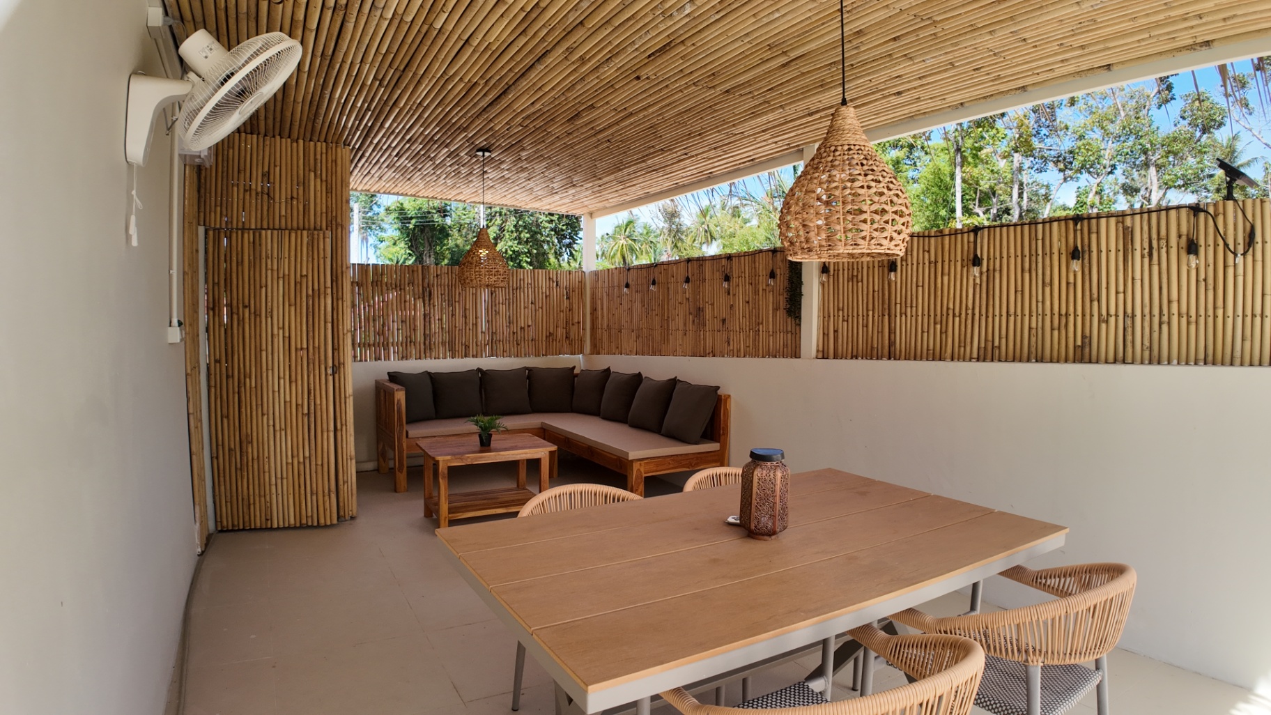 Outdoor seating corner beside the pool at Villa Reina