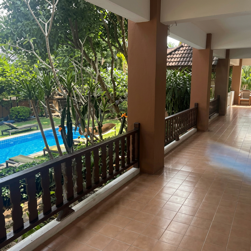 Covered walkway leading past the pool