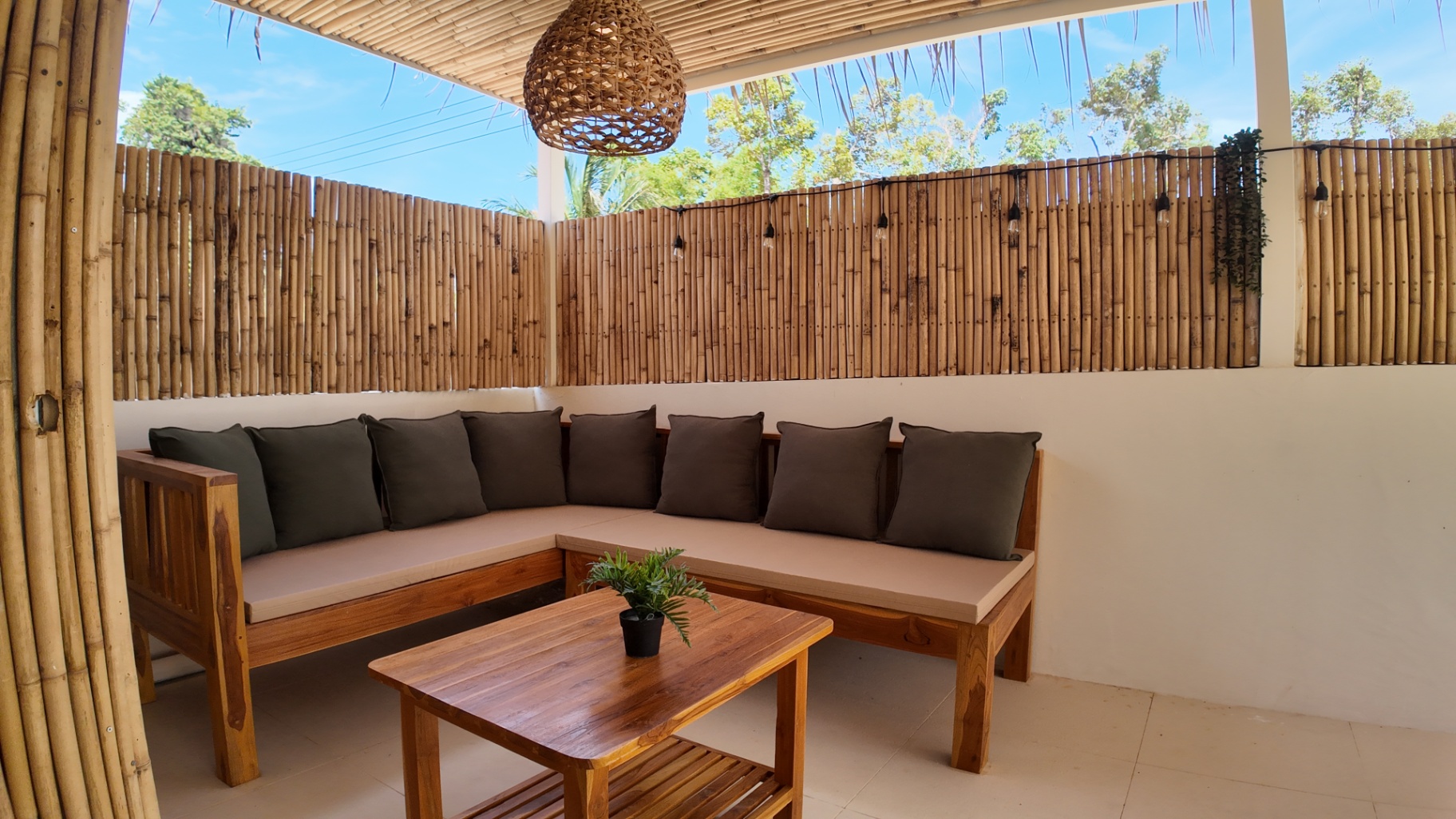 Covered outdoor sofa area at Villa Reina