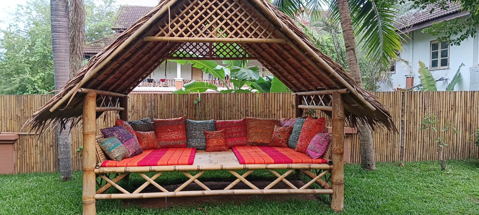 Bamboo sala with Thai cushions in the garden