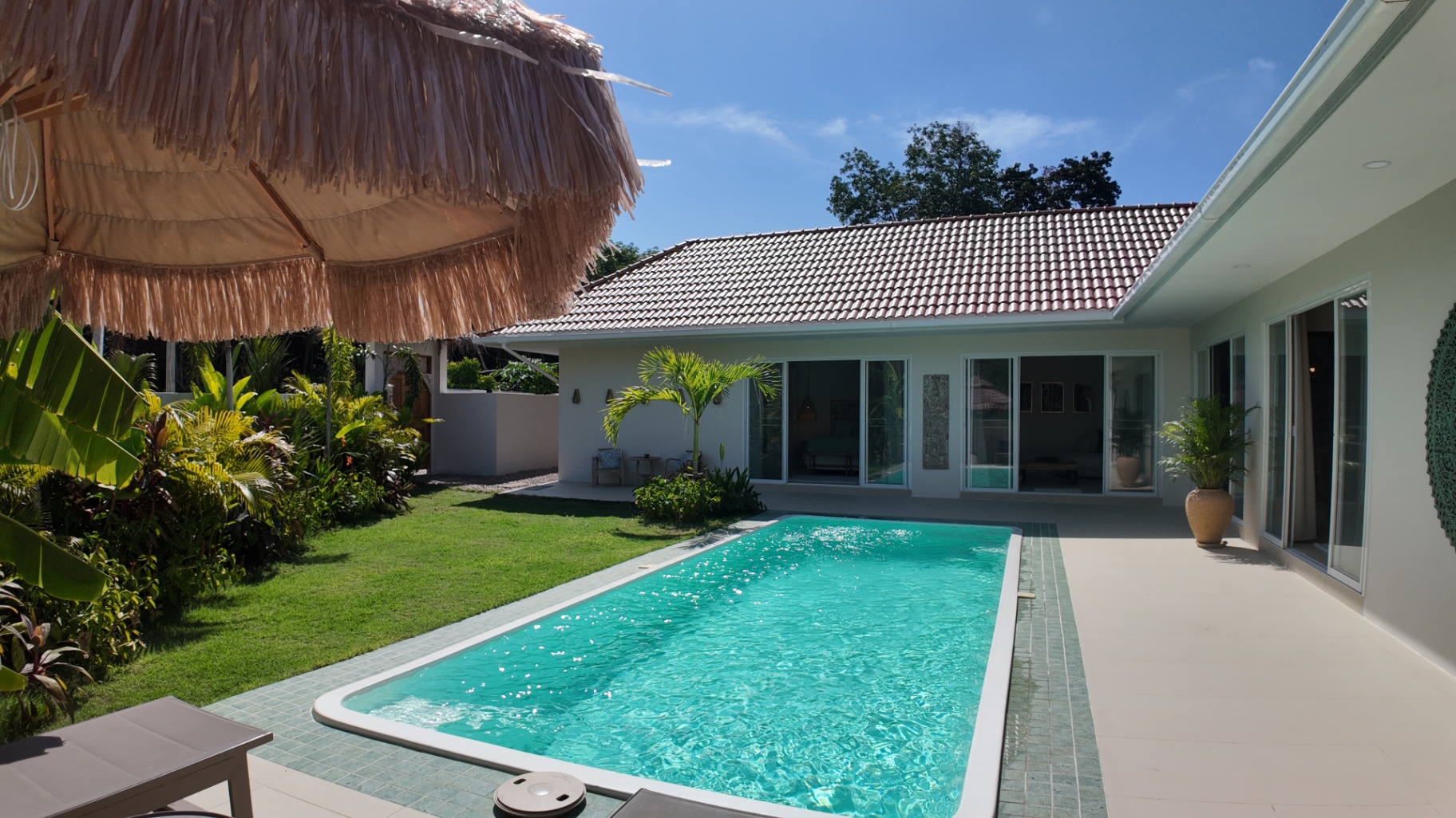 Wide outdoor overview of Villa Reina and the pool terrace